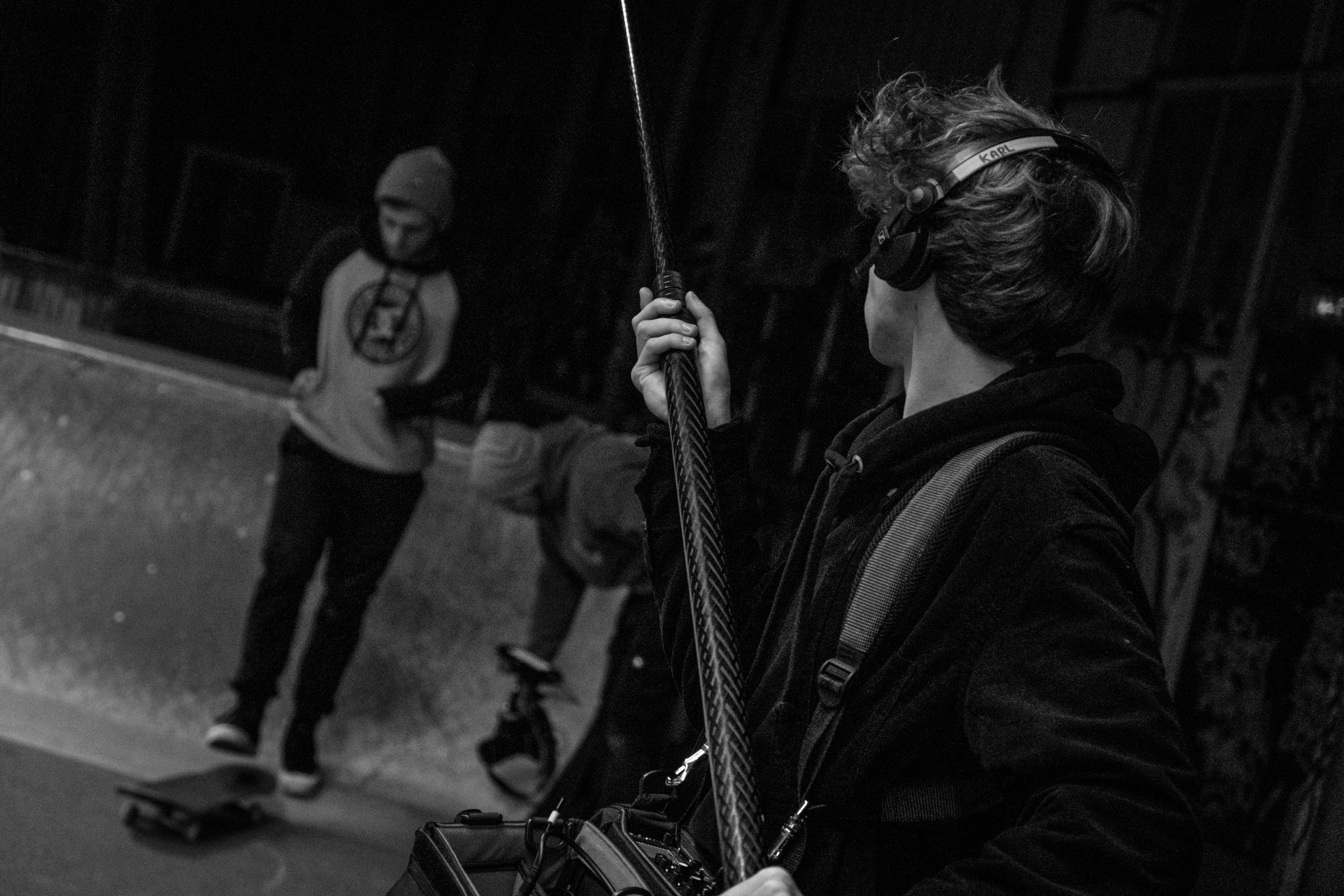 A person using a synthesizer in a colorful studio.